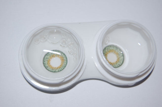 opaque lenses for dark eyes in a contact lens case with solution